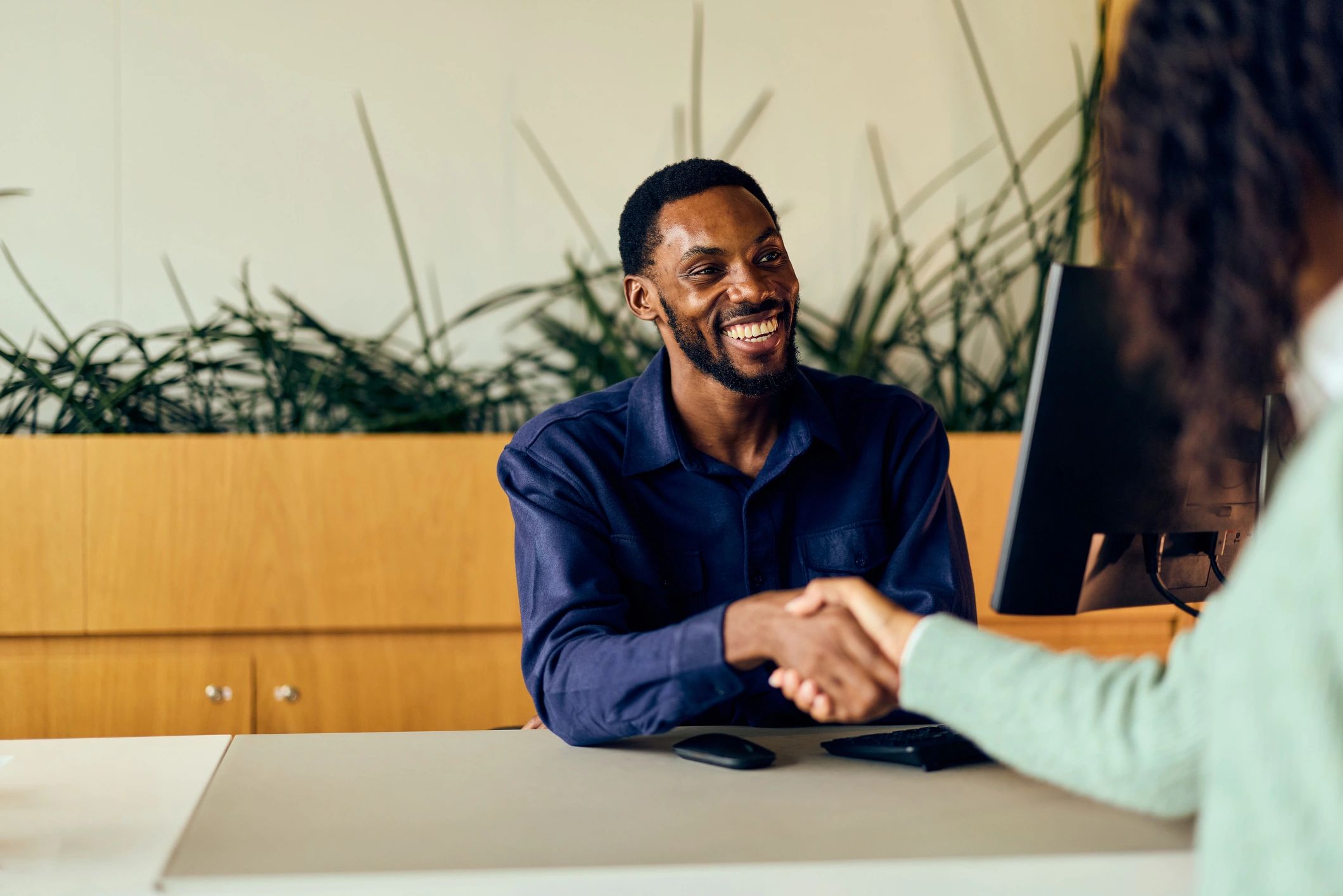 Customer meeting with dealership representative to discuss financing options